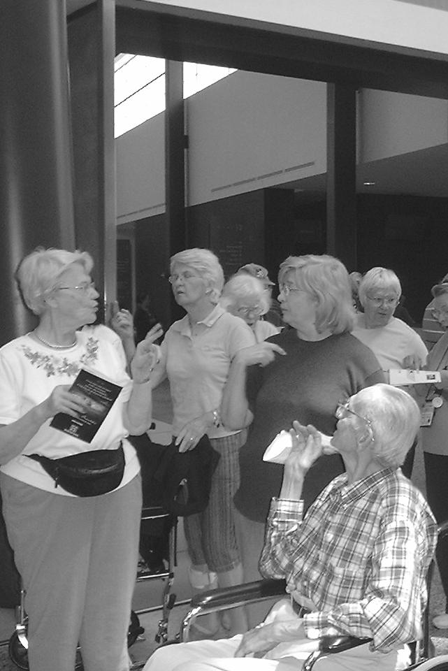 ECD members including Ginny Lindsay and her father Clifford Doctermann chat in lobby of air and space museum in Virginia