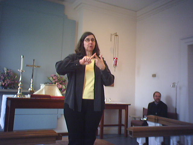 Dr. Frances Croft making an announcement after church