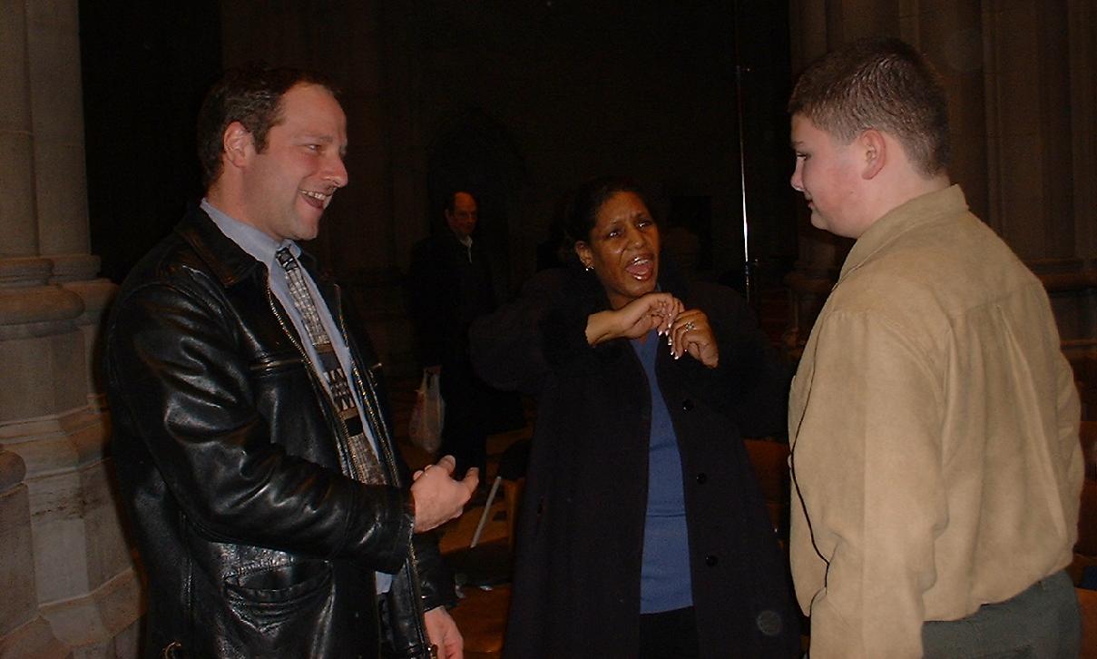 Richard Ellis, Kim Veney, and Kane Beatty chat after Christmas Eve service at Cathedral