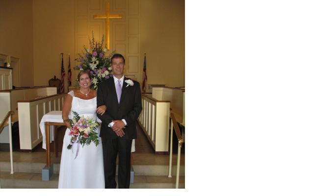 Karen and Thomas Hattaway smiling joyfully in St. John's church