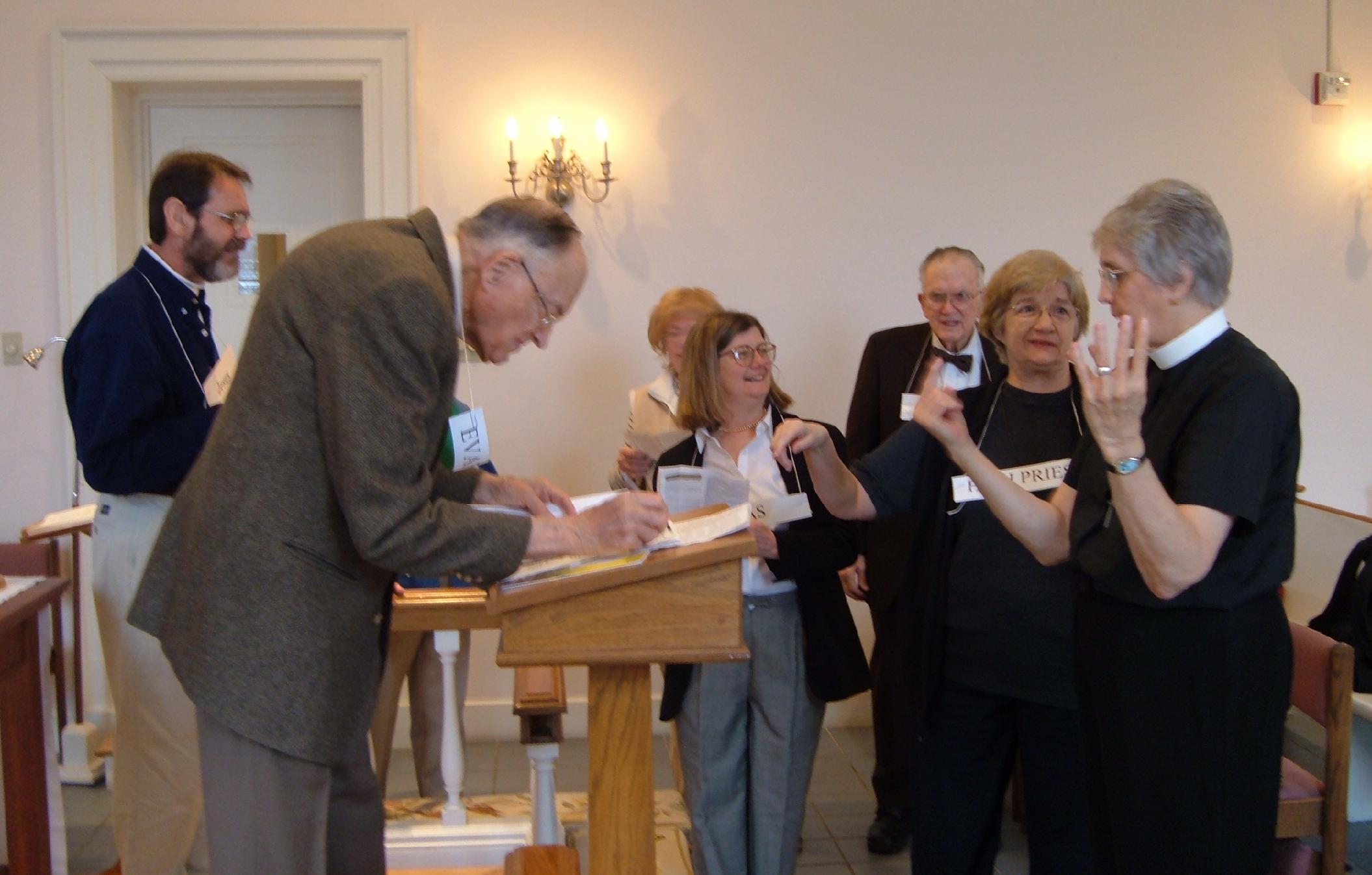 Mike Martin, Rudy Hines, Shelley Simms (with Christina Duley behind her), Marc Kleberg, and Ginny Lindsay listen to the Rev. Barbara Allen describe how the Passion Narrative will proceed