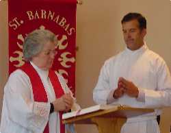 The Rev. Mitzi Noble reading the Gospel