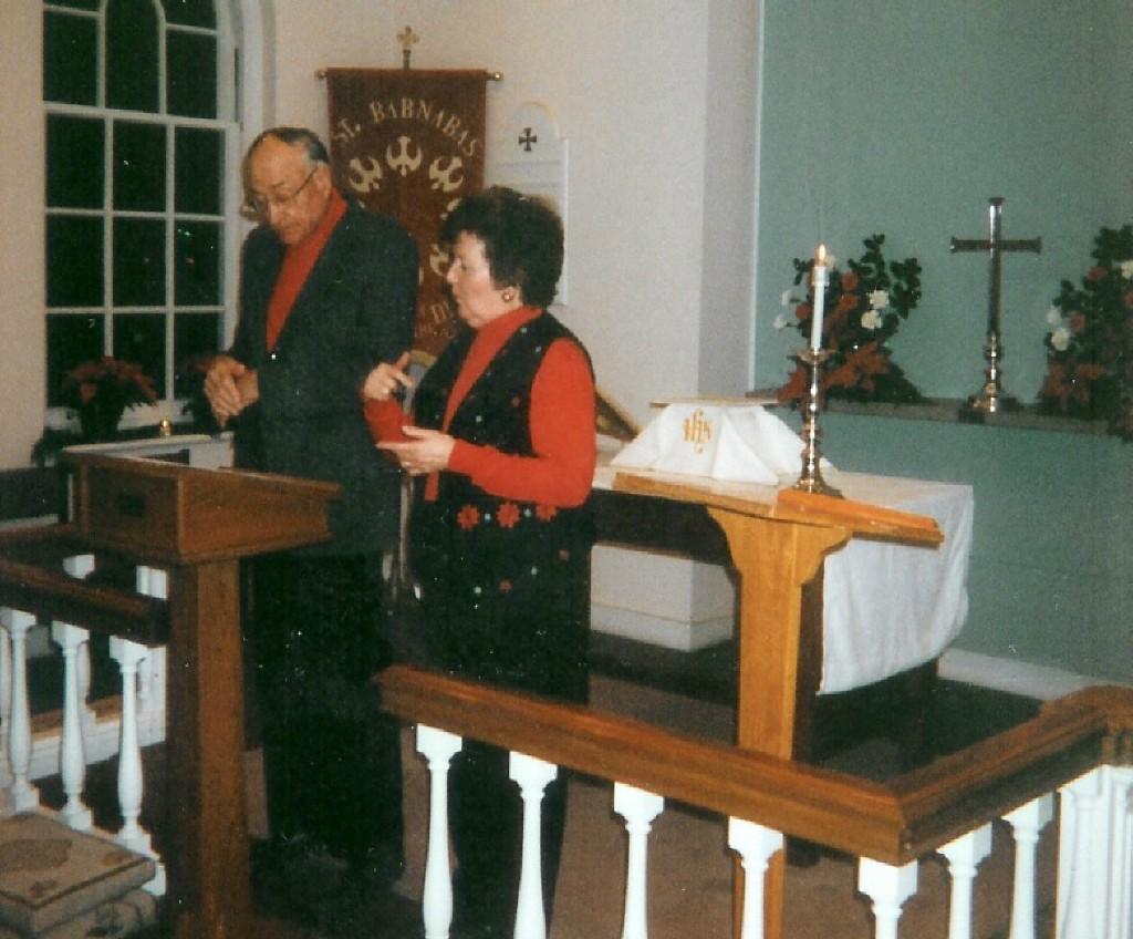 undated photo of Rudy and Marlene, looks like they are leading Prayers of the People at an evening service (Christmas Eve?)