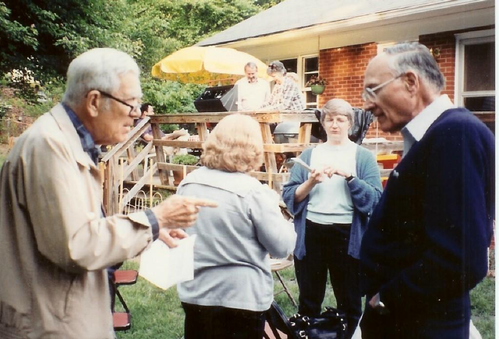 undated photo of summer backyard gathering including Rudy Hines, Ginny Lindsay and others